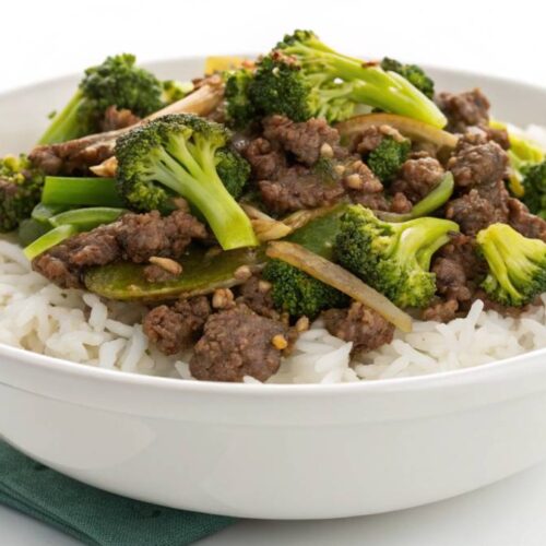 Homemade ground beef and broccoli stir-fry with glossy sauce, served over rice