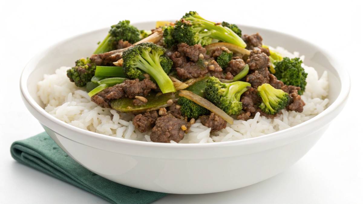 Homemade ground beef and broccoli stir-fry with glossy sauce, served over rice