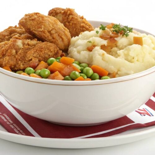 Homemade KFC Bowl with crispy chicken, mashed potatoes, corn, and gravy