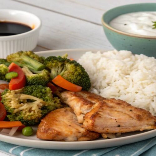 Colorful one-pan chicken and veggie Quick lunch for Working Parents with rice in skillet
